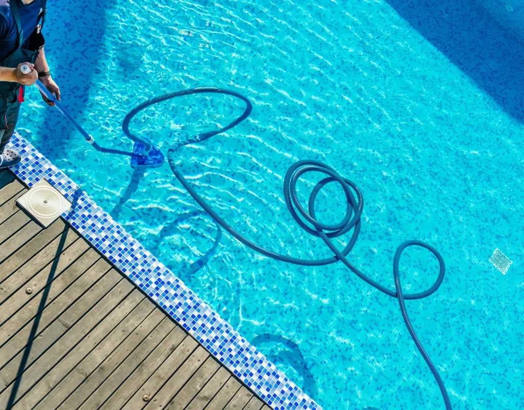 Modern pool remodel featuring spa spillover, new tile, and ambient lighting in Denton, TX
