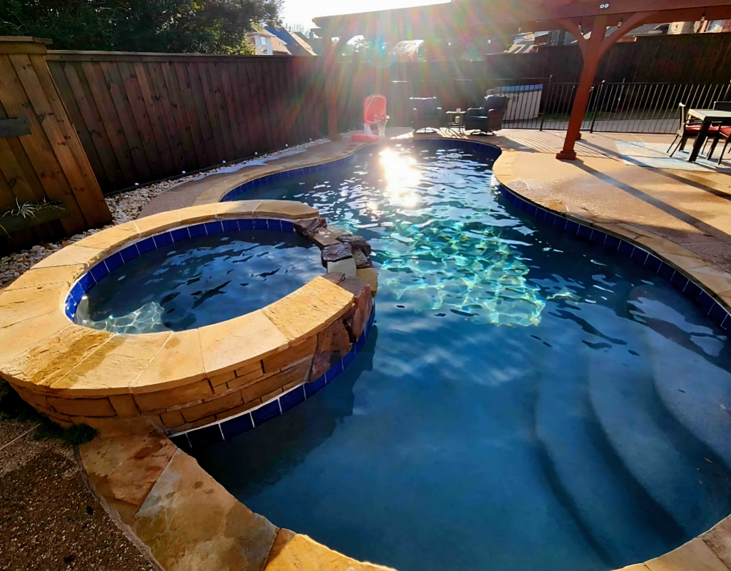 Modern pool remodel featuring spa spillover, new tile, and ambient lighting in Denton, TX