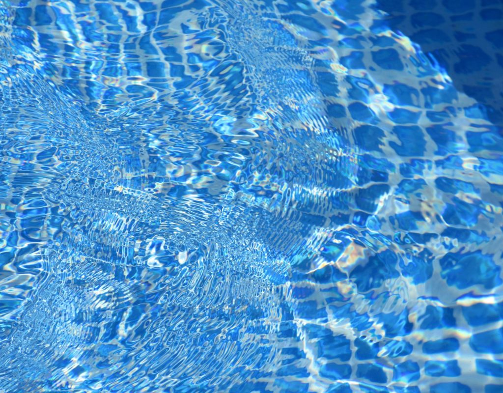 Pool maintenance team at North Point Pools cleaning a pool in Keller, TX